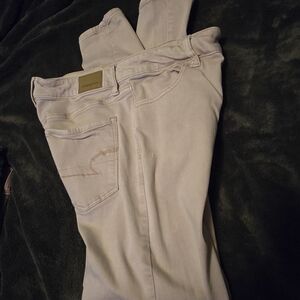 American Eagle jeans size 10 in a tan color.